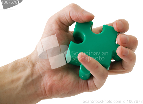 Image of Puzzle slice in a hand