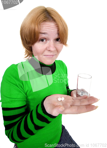Image of Girl with a glass and tablets