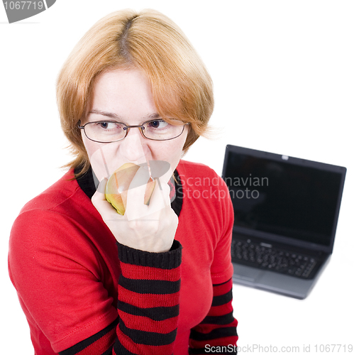 Image of Woman bites an apple