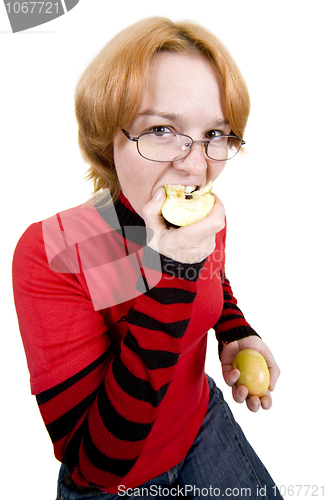 Image of The girl eats an two apples