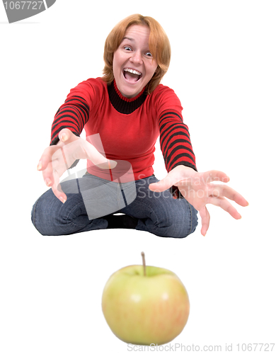 Image of Woman stretch a hand to apple