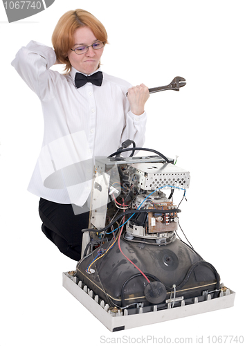 Image of The girl repairing equipment
