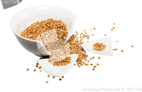 Image of Broken white cup and buckwheat