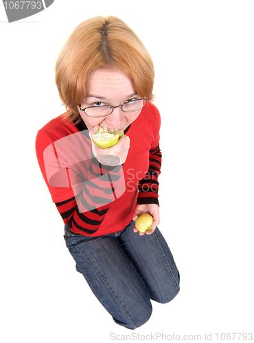 Image of The girl eats an two apples