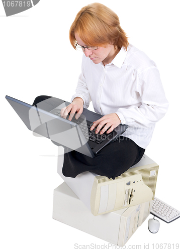 Image of Girl working on the laptop on a white