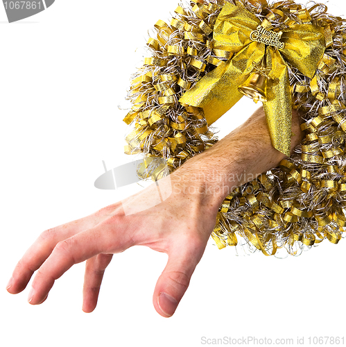 Image of Christmas wreath and hand