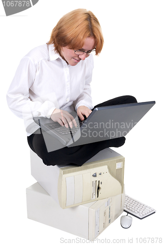 Image of Girl working on the laptop on a white