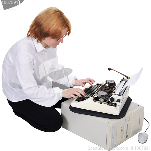 Image of Girl printing on an typewriter