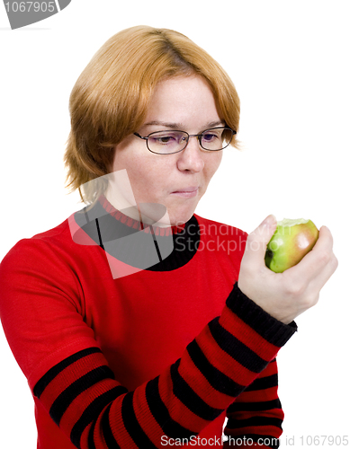 Image of The girl eats an apple