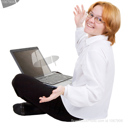 Image of Woman sitting on a floor with the notebook on white