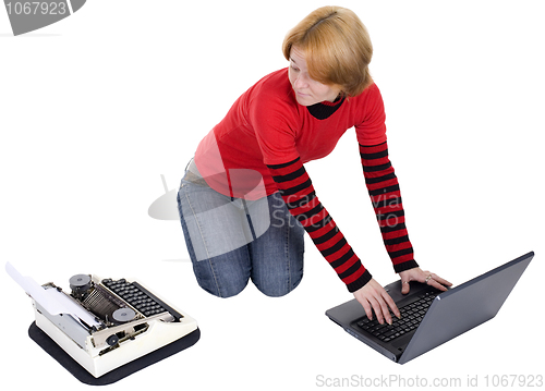 Image of Girl with the laptop and a typewriter