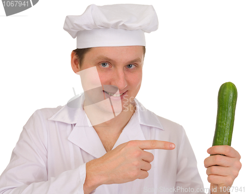 Image of Cook with cucumber in hand