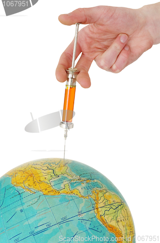 Image of Syringe and terrestrial globe