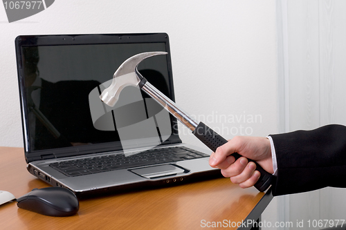 Image of Hammer and the laptop