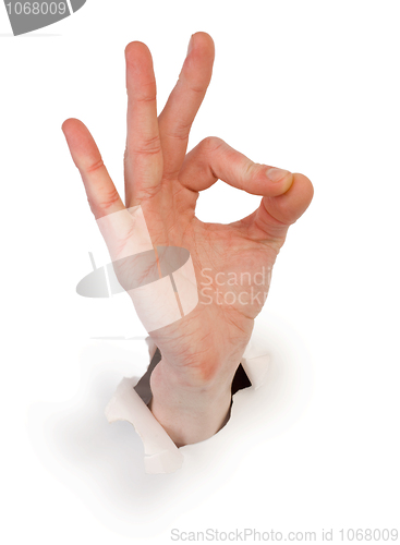 Image of Gesture male hand through white paper