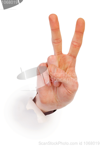 Image of Gesture male hand through white paper