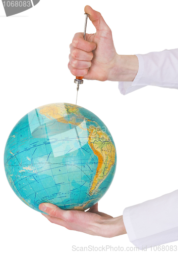 Image of Terrestrial globe and syringe