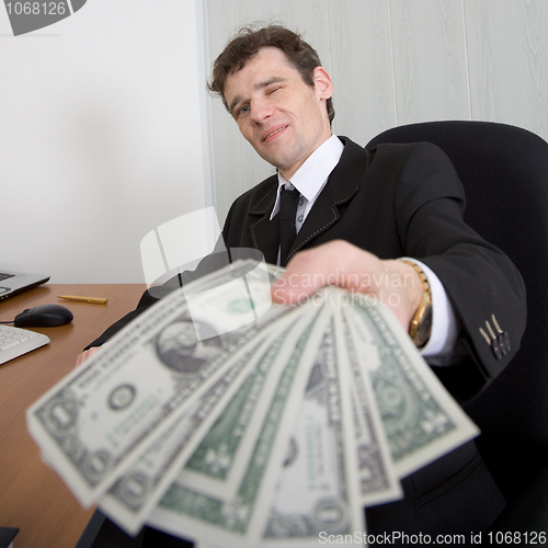 Image of The artful businessman and money