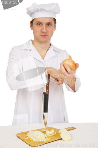 Image of Cook with knife and preparation board
