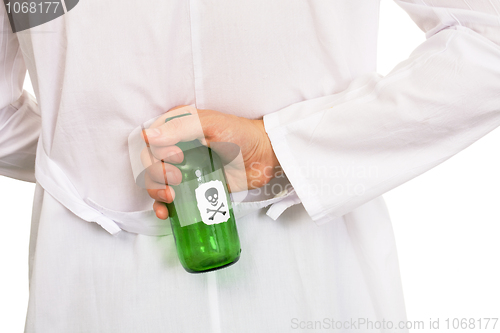 Image of Hand with green bottle