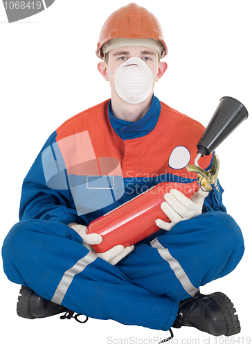 Image of Man in overllas and fire-extinguisher