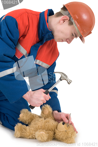 Image of Labourer with bear and hammer