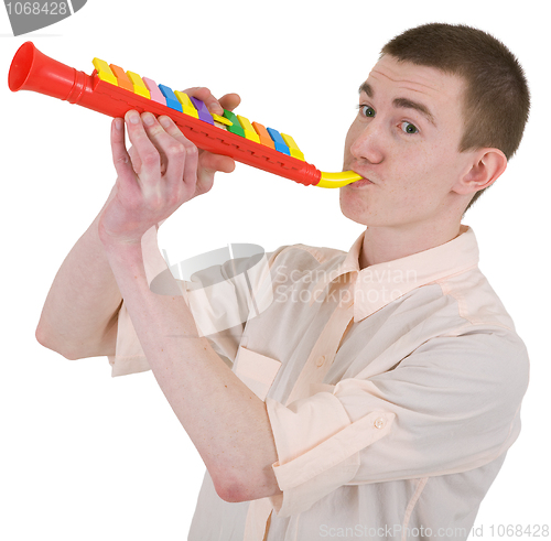 Image of Young man and toy, trumpet