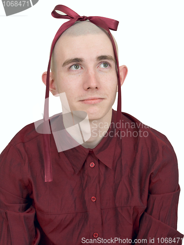Image of Young man with small bow on head