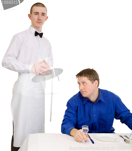 Image of Waiter and guest of restaurant
