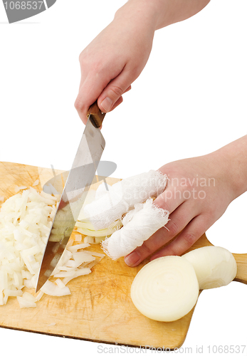 Image of Hands, cutting onions