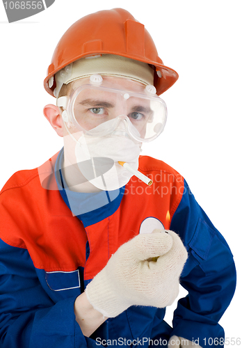 Image of Man in respirator smoking