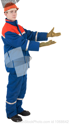Image of Worker in overalls and a helmet