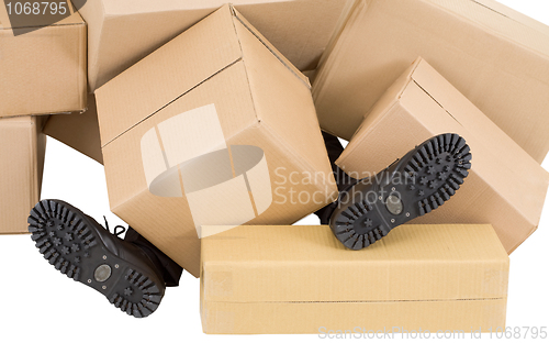 Image of Male feet and heap of boxes