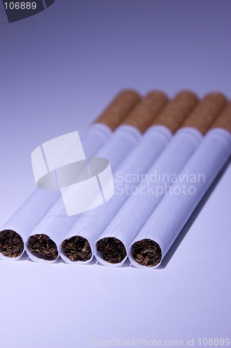 Image of Isolated Cigarettes Under Blue Light