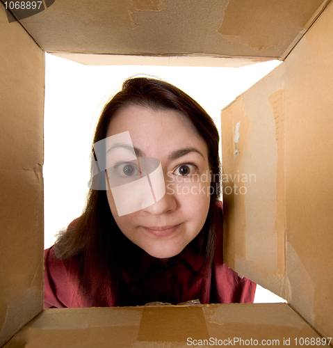 Image of Female portrait through  cardboard box