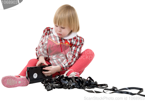 Image of Girl in the red dress with video cassette