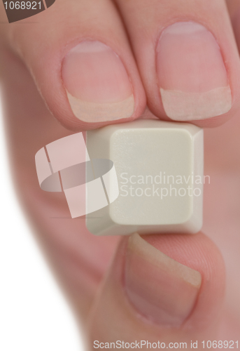 Image of Hand holds a computer key