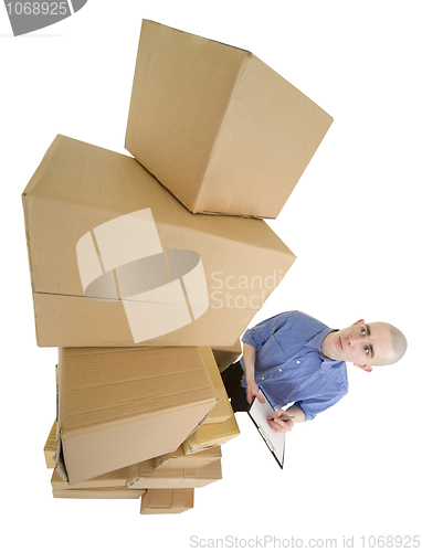 Image of Man and pile cardboard boxes