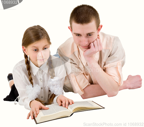 Image of Man and girl reading book 