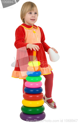 Image of Little girl and toy pyramid