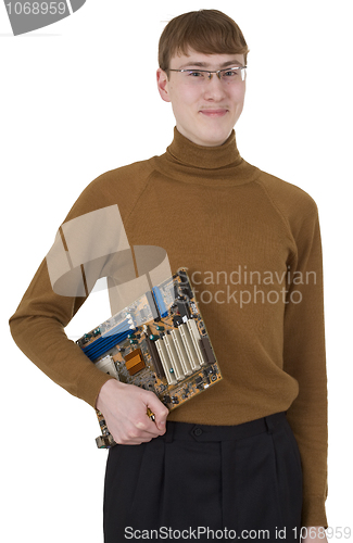 Image of Young man holding motherboard