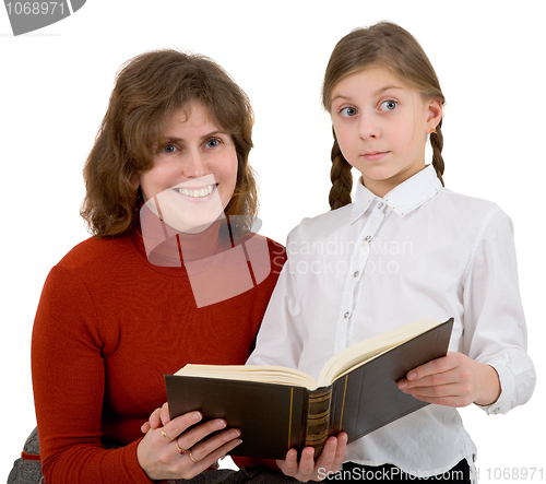 Image of Woman with girl reading book