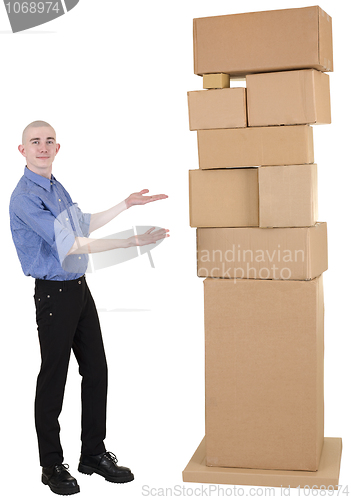 Image of Man showing on pile cardboard boxes