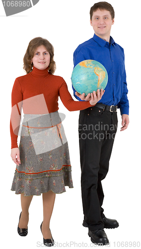 Image of Man and woman hold globe