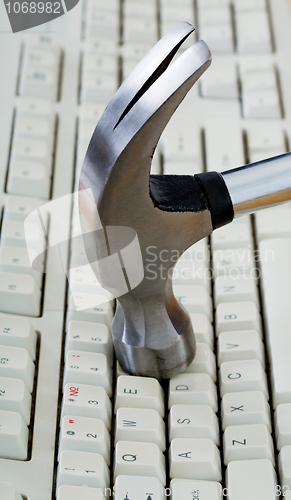 Image of Metal hammer on keyboard