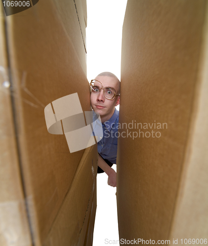 Image of Face and cardboard boxes