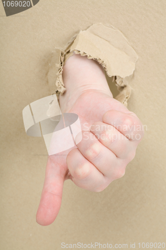 Image of Gesture male hand through cardboard