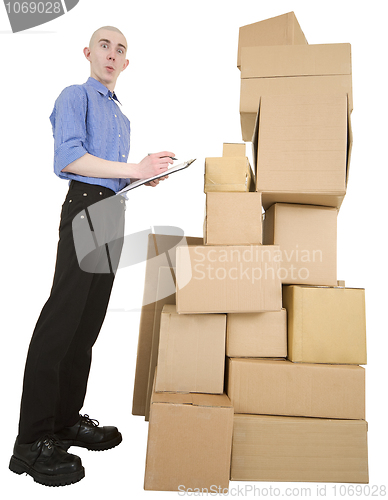 Image of Man and pile cardboard boxes