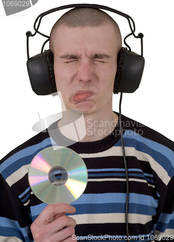 Image of Man in phones and compact disk