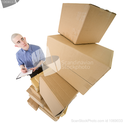 Image of Man and pile cardboard boxes